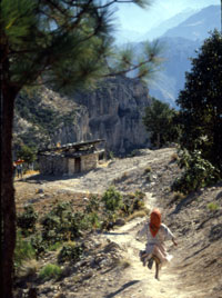 Young Tarahumara girl runs to mountain side school on The California Native Copper Canyon Tours